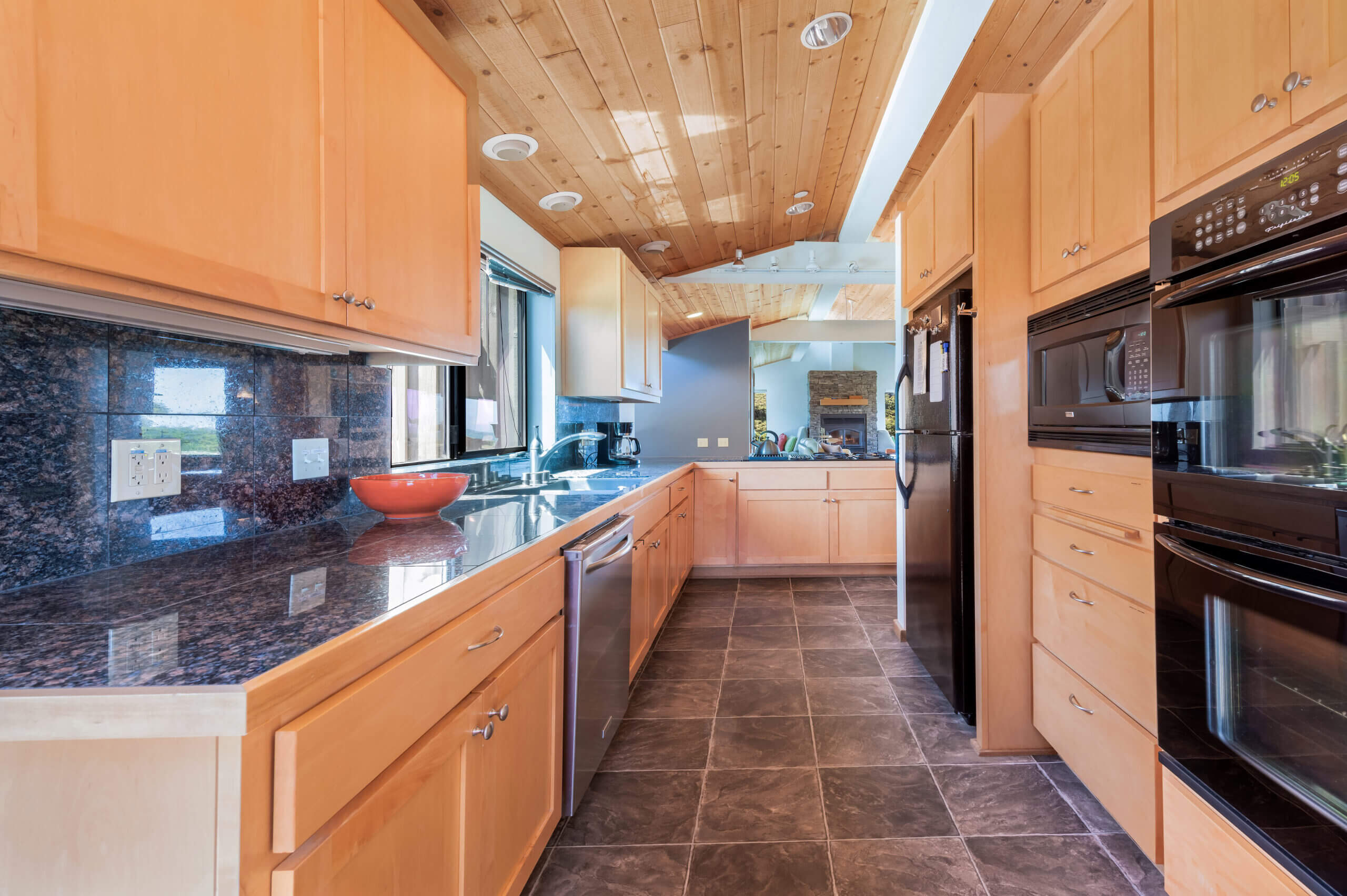 Bella Luna kitchen with marble floors and wood ceiling