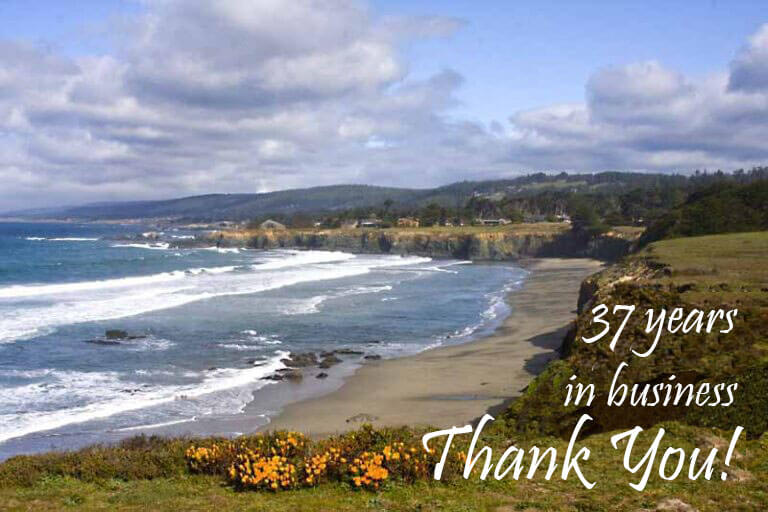 Sea Ranch Escape ocean coastline with flowers and text: 37 years in business, Thank You!