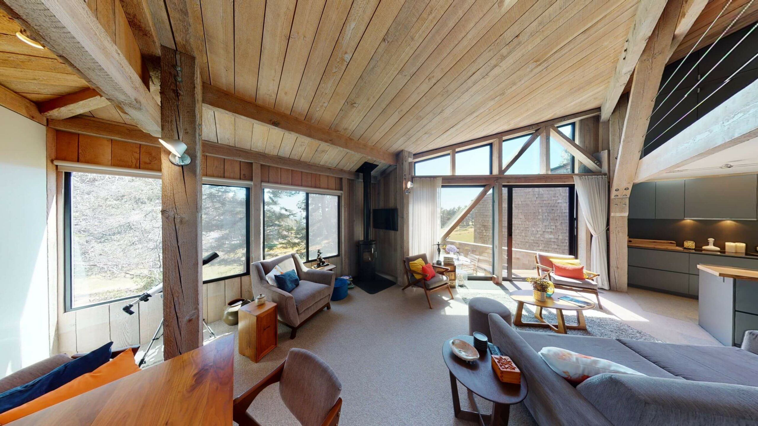 Seaview living room wood beam ceilings and large windows