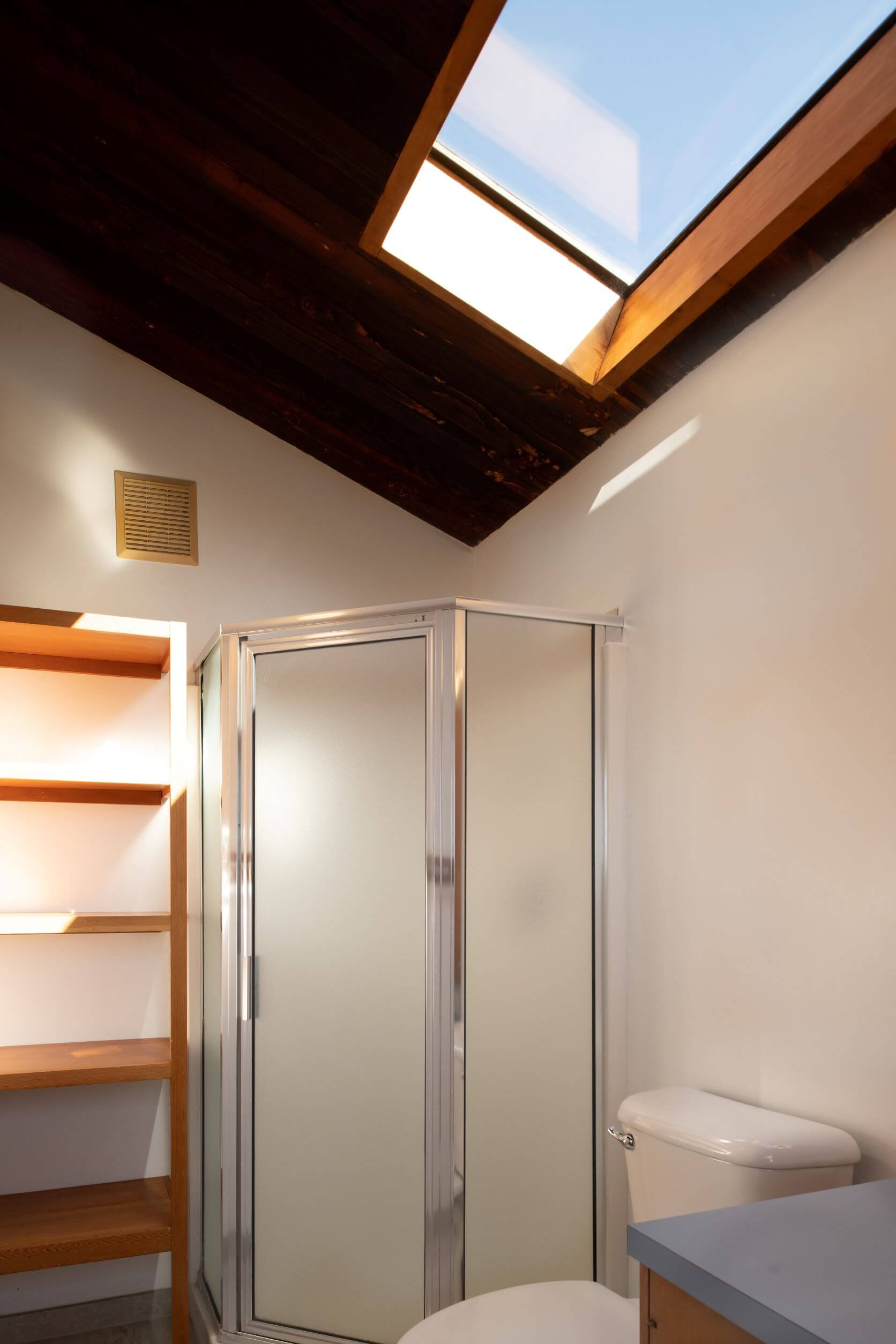 Lighthouse - bright bathroom with skylight and single shower